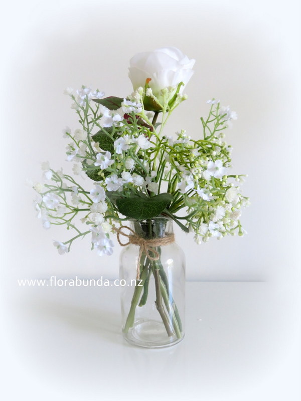 White rose and gypsophila bottle of artificial table flowers