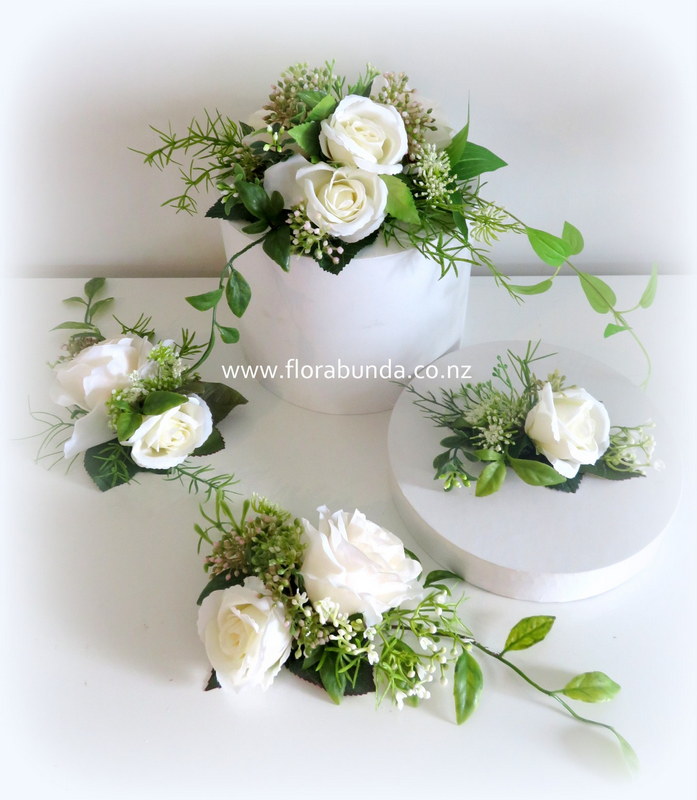 Cake flowers white roses and greenery