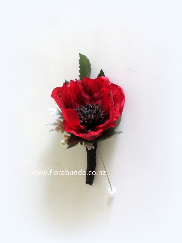 Red Poppy bound in Black for Mans Buttonhole