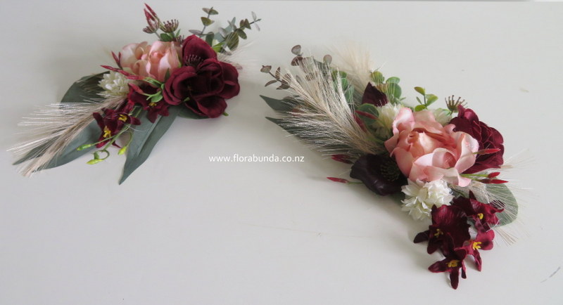 Burgundy blush wedding cake flowers.