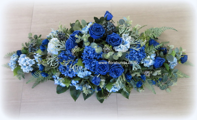 Blue fake flowers for coffin