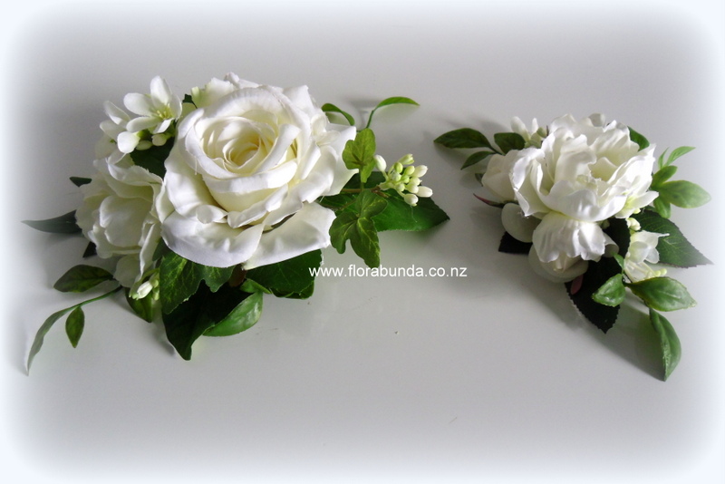 white rose and greenery cake sprays