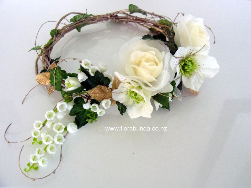 White stylish hair circlet on vine