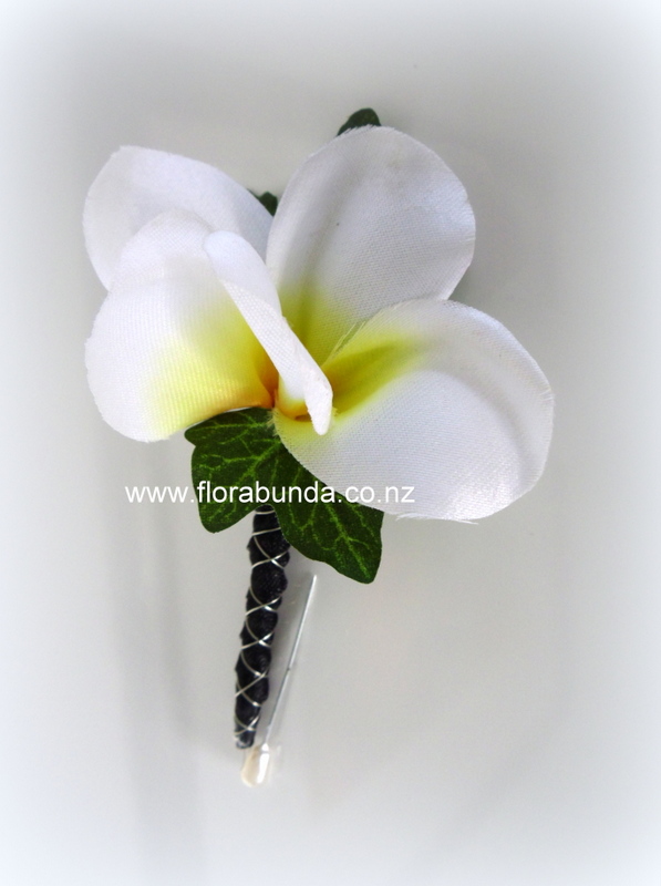 White Frangipani buttonhole with black bound stem