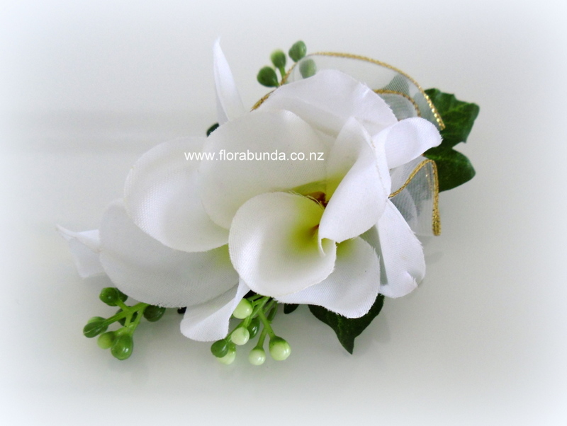 White and yellow frangipani ladies buttonhole